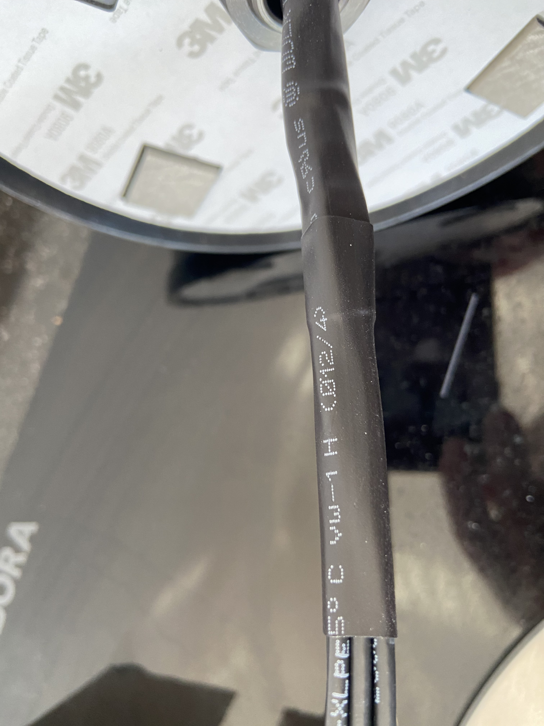 Antenna with shrink tubes applied to group and protect the cables